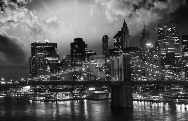 Amazing night in New York City - Manhattan Skyline and Brooklyn Bridge.