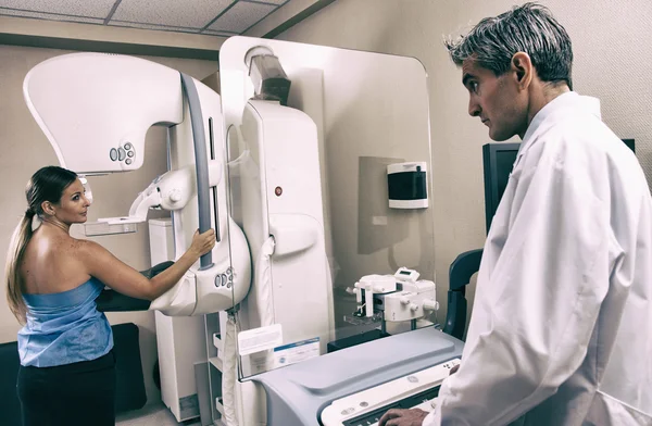 Doctor with a patient in an examination — Stock Photo, Image