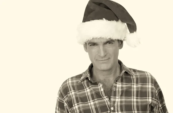 Lächelnder Mann mit Weihnachtsmütze — Stockfoto