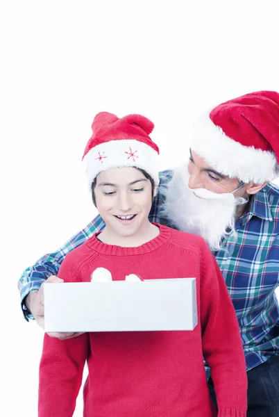 Surprised son receiving Christmas gift — Stock Photo, Image