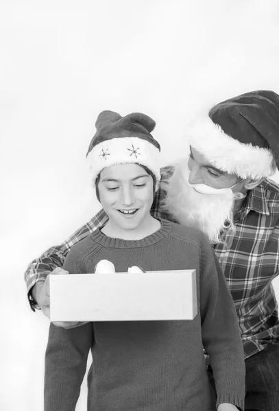 Surprised son receiving Christmas gift — Stock Photo, Image