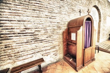 Confession box inside an italian church clipart