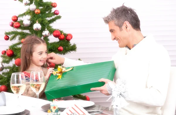 Child receiving gift from dad — Stock Photo, Image