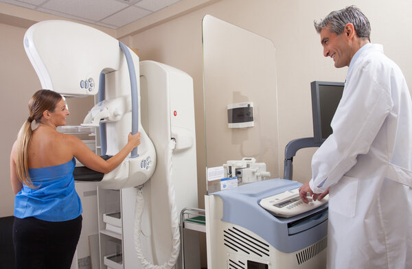 Female patient near mammography machine