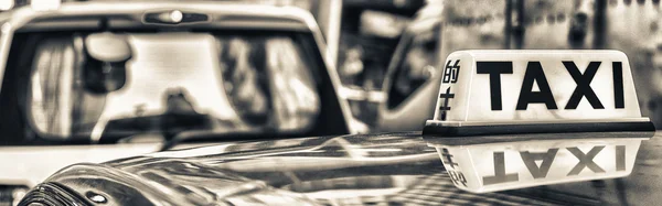 Taxi sign with cab reflection — Stock Photo, Image