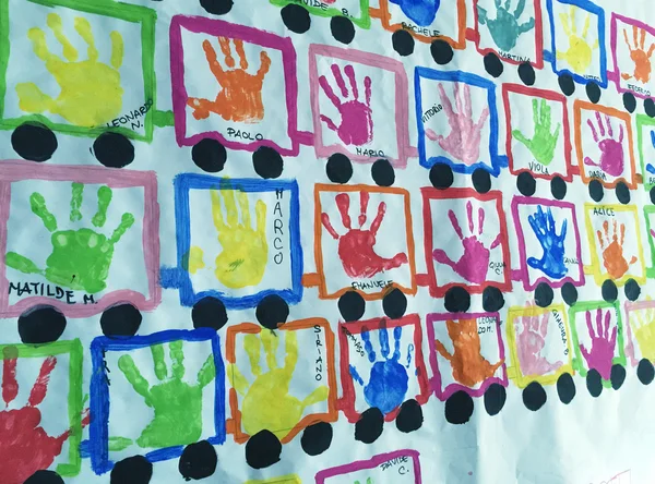 Baby names and handprints on a school wall — Stock Photo, Image