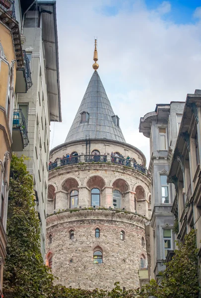 Galata Tower framed by ancient buildings — Stock Photo, Image