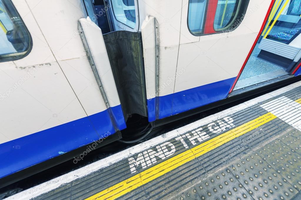 Famous Mind The Gap sign in London underground station