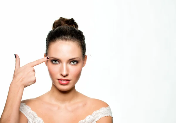 Beautiful girl shooting at her head — Stock Photo, Image