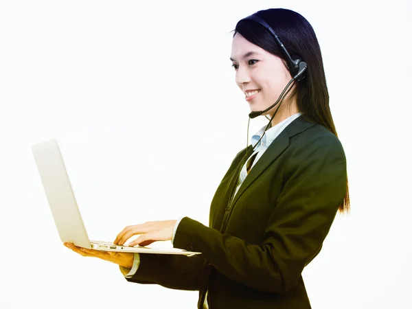 Asian female operator with laptop computer — Stock Photo, Image