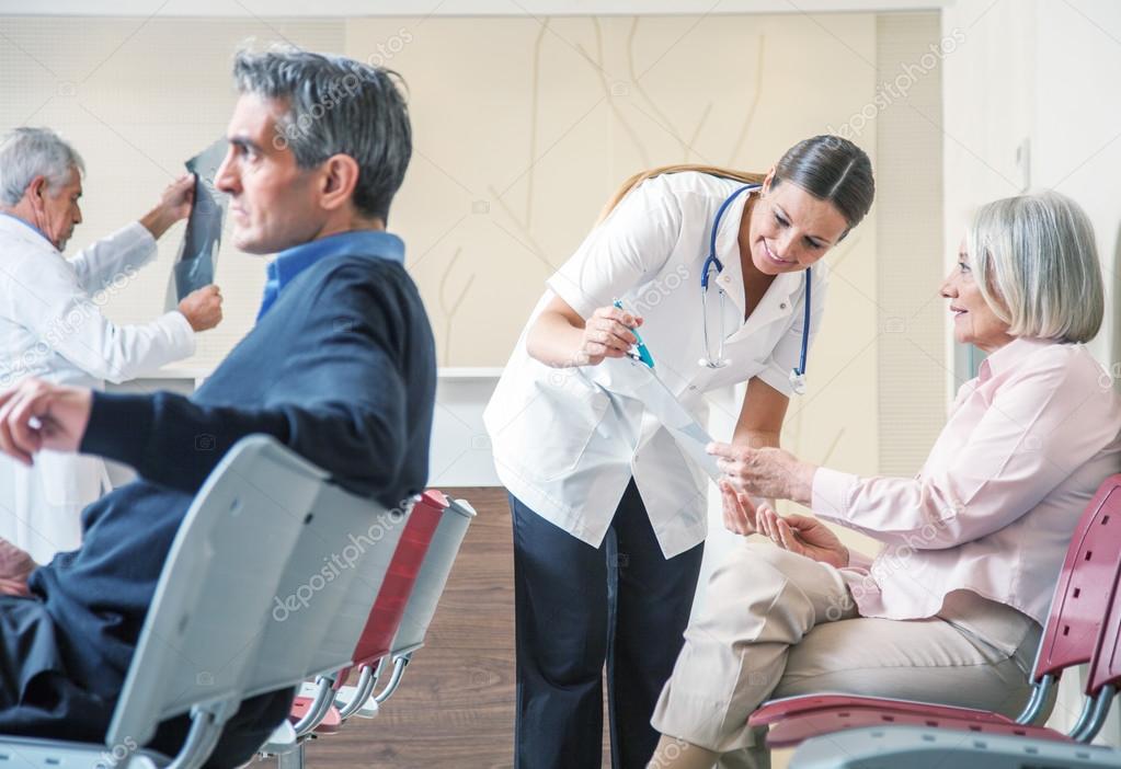 Doctors and patients speaking in the hospital