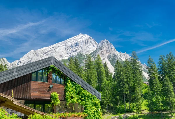 Building in the middle of mountains valley — Stock Photo, Image