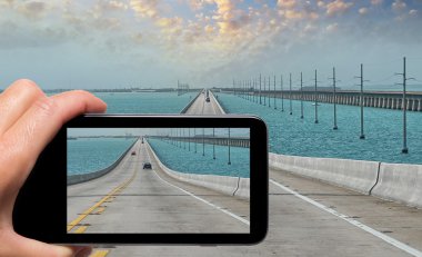 Female hand with smartphone taking a picture