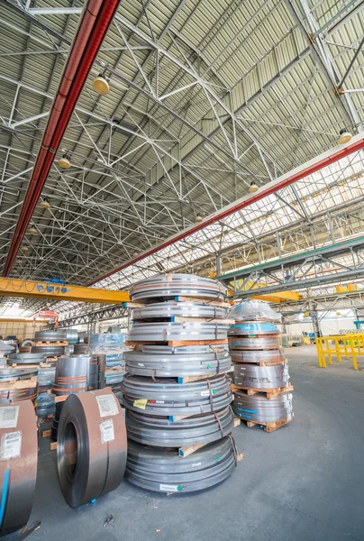 Cold rolled steel coils in storage area ready to feed to machine — Stock Photo, Image