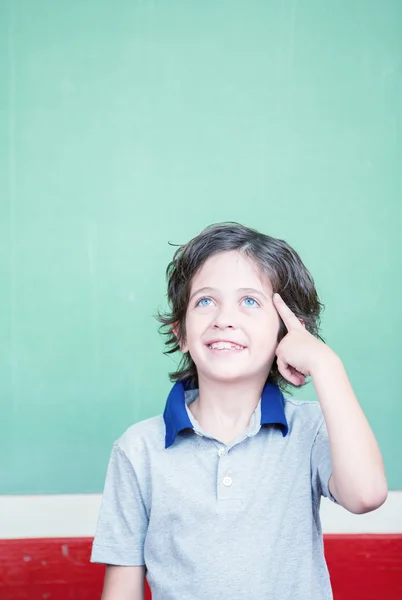 Kid having idea in classroom — Stock Photo, Image