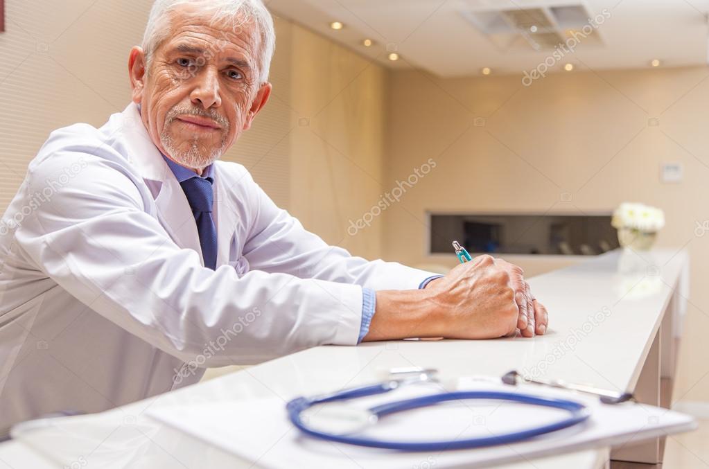 Sad expert male doctor