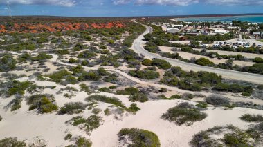 Aerial drone view of Monkey Mia coastline Western Australia with turquoise waters and sandy beaches.
