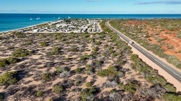 Aerial drone view of Monkey Mia coastline Western Australia with turquoise waters and sandy beaches.