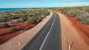 Aerial drone view of Monkey Mia coastline Western Australia with turquoise waters and sandy beaches.