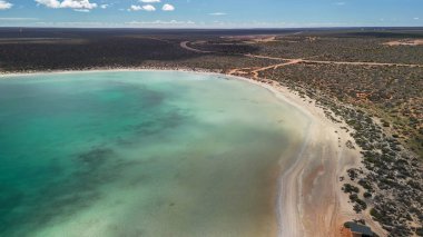 Scenic aerial panorama of Little Lagoon Shark Bay WA surrounded by desert and blue coastline.
