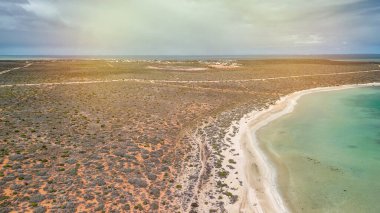 Drone photography of Little Lagoon close to Monkey Mia showing vivid colors and shallow waters.