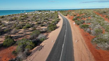 Aerial drone view of Monkey Mia coastline Western Australia with turquoise waters and sandy beaches.