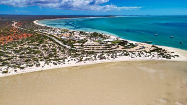 Aerial drone view of Monkey Mia coastline Western Australia with turquoise waters and sandy beaches.