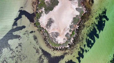 Aerial drone view of Eagle Bluff near Monkey Mia Western Australia with rugged cliffs and turquoise waters.