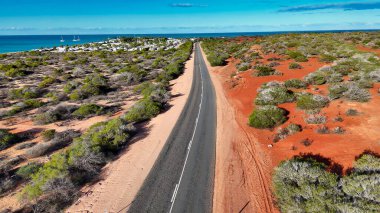 Aerial drone view of Monkey Mia coastline Western Australia with turquoise waters and sandy beaches.