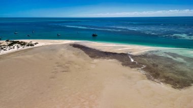 Aerial drone view of Monkey Mia coastline Western Australia with turquoise waters and sandy beaches.