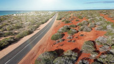 Aerial drone view of Monkey Mia coastline Western Australia with turquoise waters and sandy beaches.
