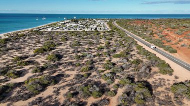 Aerial drone view of Monkey Mia coastline Western Australia with turquoise waters and sandy beaches.