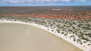 Aerial drone view of Monkey Mia coastline Western Australia with turquoise waters and sandy beaches.