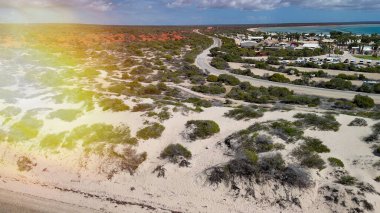 Aerial drone view of Monkey Mia coastline Western Australia with turquoise waters and sandy beaches.