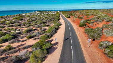 Aerial drone view of Monkey Mia coastline Western Australia with turquoise waters and sandy beaches.