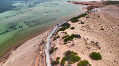 Aerial drone view of Eagle Bluff near Monkey Mia Western Australia with rugged cliffs and turquoise waters.