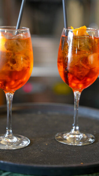 Assorted appetizers served in red glass bowls on a restaurant table for elegant dining.