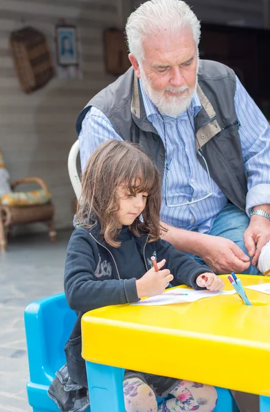 Mature teacher with pupil — Stock Photo, Image