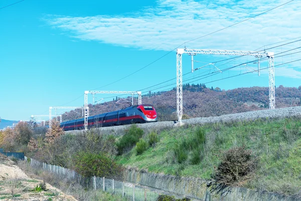 Fast speeding up train in countryside railway — Stock Photo, Image