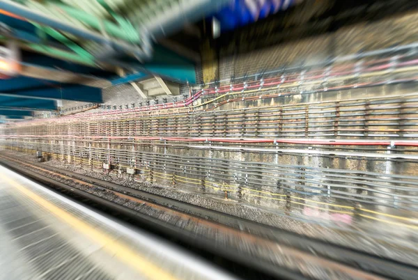 Interior of subway with cables and railway — Stock Photo, Image