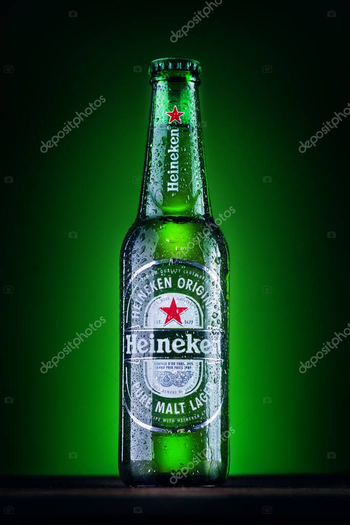 Orhei, Moldova - June 4, 2020 : Bottle of Heineken Lager Beer on green background. Heineken is the flagship product of Heineken International