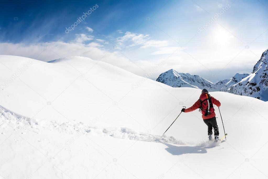 Skiing: male skier in powder snow