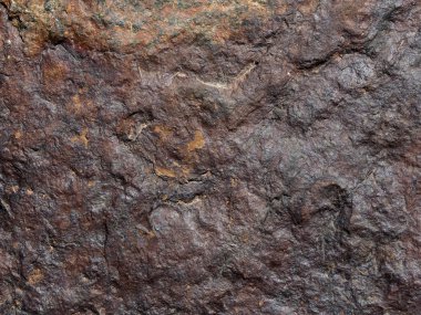 Rock doku: arka plan olarak yararlı bir kırmızı-kahverengi taş yakın çekim