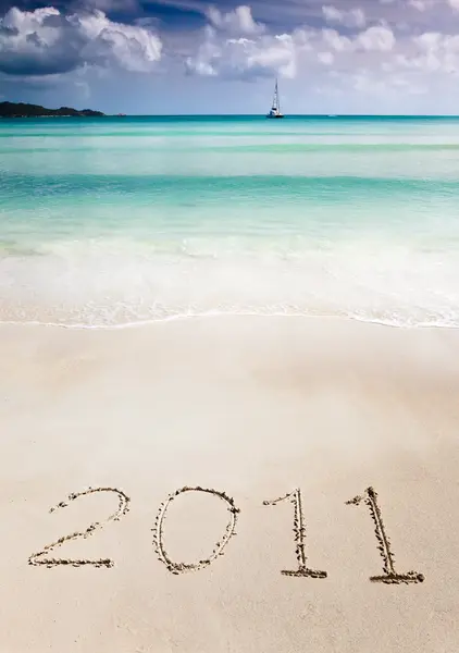Year 2011 writenn in the sand — Stock Photo, Image