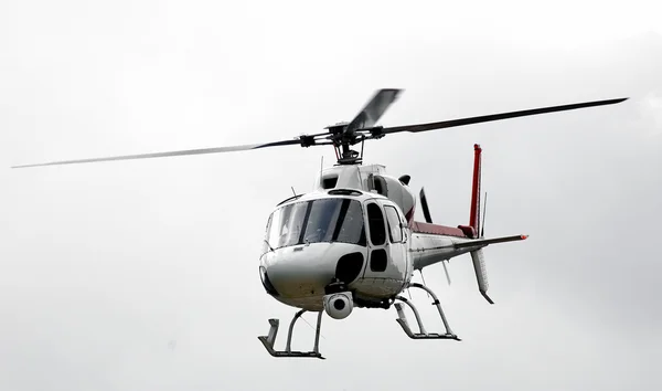 White flying helicopter — Stock Photo, Image