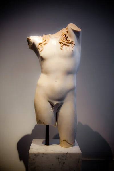 Part of an ancient roman statue of Dionysus — Stock Photo, Image