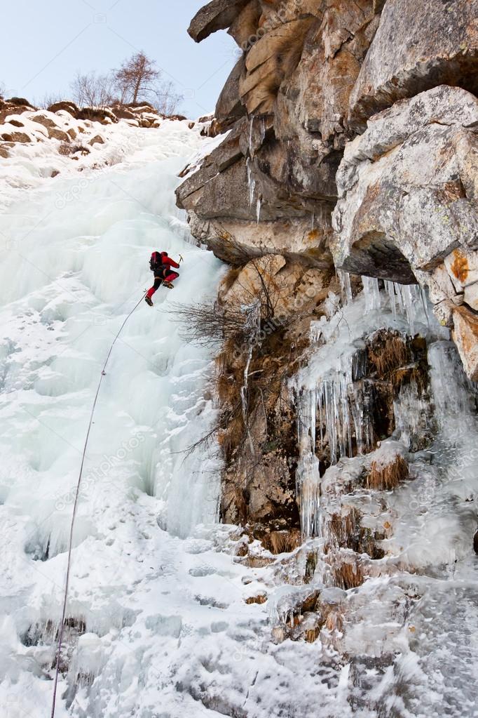 Ice climber on a steep ice fall