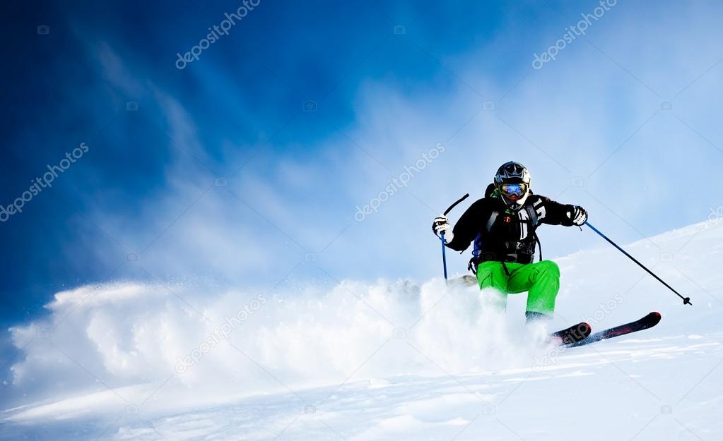 Man's skiing in fresh snow