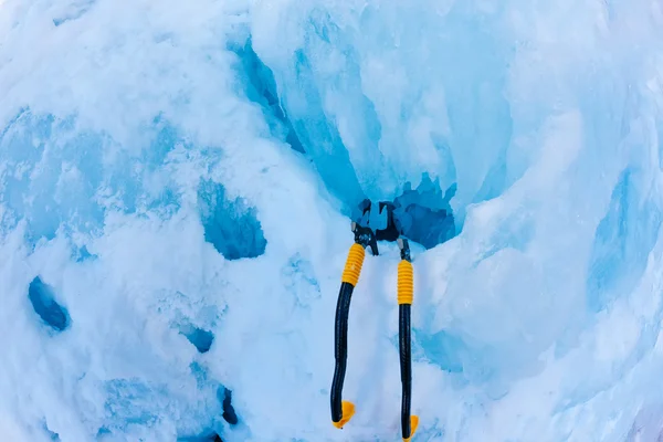 Two modern ice tools planted in the icefall during a pitch. — Stock Photo, Image