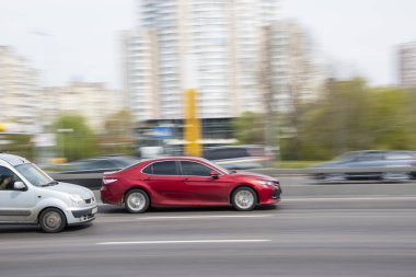 Ukraine, Kyiv - 30 April 2021: Red Toyota Camry car moving on the street. Editorial